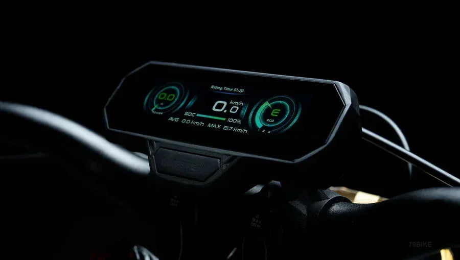 Close-up of a 79BIKE Falcon Pro Electric Dirt motorcycle dashboard with digital display in dark setting