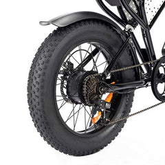 Close-up of a Ridstar Q20 Mini Electric bicycle wheel with thick tire and chain mechanism on a white background