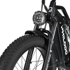 Close-up of a black PHILODO Jumbo Dual Motor Electric Bike with visible branding on a white background