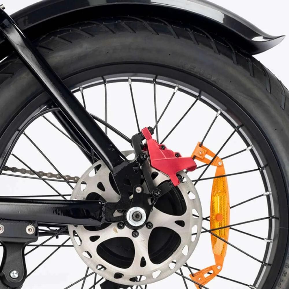 Close-up of a YVY C20 Max Electric bicycle wheel with disc brake and chain guard on a white background
